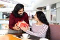 Happy romantic young eastern couple celebrating special occasion together Royalty Free Stock Photo