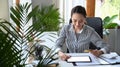 Woman holding credit card and making payment online on digital tablet. Royalty Free Stock Photo