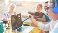 Millennials people making a video feed online at beach party - Speaker and friends starting live social streaming - New media Royalty Free Stock Photo