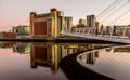 The Millennium Bridge in Newcastle at sunset, reflecting in the almost still River Tyne beneath Royalty Free Stock Photo
