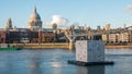 The Millennium bridge with St Paul cathedral and the skyline of the City of London at sunset Royalty Free Stock Photo