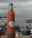 Miller light giant bottle and Busch beer sign with Bridgestone Firestone sign