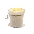 Millet in burlap sack isolated on white background. Raw yellow millets in a jute bag. Royalty Free Stock Photo