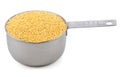 Millet grains in a measuring cup Royalty Free Stock Photo