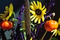 Millet grass sunflowers pumpkin on a stick purple filler autumn bouquet closeup horizontal