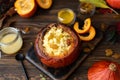 millet porridge baked in pumpkin with honey and raisins Royalty Free Stock Photo