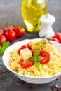 Millet porridge with tomatoes and cheese Royalty Free Stock Photo