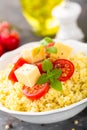 Millet porridge with tomatoes and cheese Royalty Free Stock Photo