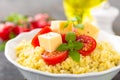 Millet porridge with tomatoes and cheese Royalty Free Stock Photo