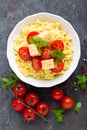 Millet porridge with tomatoes and cheese Royalty Free Stock Photo