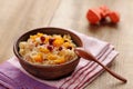 Millet porrige with pumpkin in clay bowl with wooden spoon Royalty Free Stock Photo