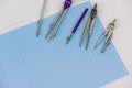 Millimeter paper with draughtsmanship equipment at the table Royalty Free Stock Photo