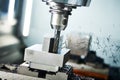 Milling cnc machine at metal work industry. Multitool precision machining. Shallow depth of view on shavings Royalty Free Stock Photo