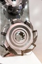Milling cutters with mechanical fastening of many-sided cutting inserts. Shallow depth