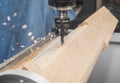 Milling machine with Computer numerical control processes wood blank at high speed Royalty Free Stock Photo