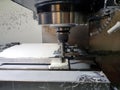 Milling machine in metalworking process. Industrial CNC metal machining by vertical mill.