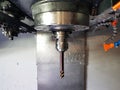 Milling machine in metalworking process. Industrial CNC metal machining by vertical mill.