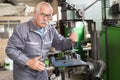 milling machine operator working in factory workshop Royalty Free Stock Photo