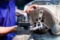 Milling machine operator working in factory Royalty Free Stock Photo