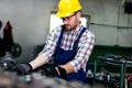 The milling-machine operator works at the lathe. Royalty Free Stock Photo