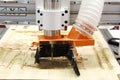 Milling a wooden board. CNC woodworking machine