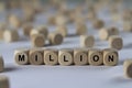 Million - cube with letters, sign with wooden cubes