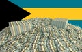 Millions of Dollars - Pile of new 100 Dollar Bills in front of the Bahamas flag Royalty Free Stock Photo