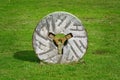 Millstone on the grass Royalty Free Stock Photo