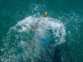 Swimming in  milos island in greece, kleftiko bay rock caves, sea swimming sailing in summer holidays Royalty Free Stock Photo