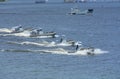 Miltary boats floating on the water, soldiers of Seaborne Special Forces aboard armed with machine guns.