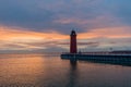 Red lighthouse at sun rise on Lake Michigan in Milwaukee Royalty Free Stock Photo