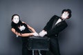 Mime actor and actress performing with suitcase Royalty Free Stock Photo