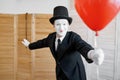 Mime artist with air balloon, comedy parody