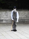 A mime artist dressed as Charlie Chaplin performs in a quiet square in Venice in June 2017