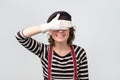Mime caucasian woman covering her eyes waiting for surprise.