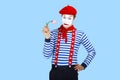 Mime with flower.Emotional funny actor wearing Royalty Free Stock Photo