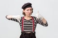 Mime making good or bad sign showing thumb up making a choice. Royalty Free Stock Photo