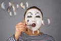 Mime portrait blowing bubbles