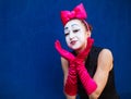 Mime portrait near a blue wall.  on blue background Royalty Free Stock Photo