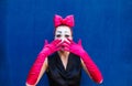 Mime portrait near a blue wall. on blue background