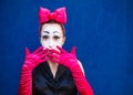 Mime portrait near a blue wall.  on blue background Royalty Free Stock Photo