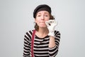 Mime pretty woman zipping her mouth shut Royalty Free Stock Photo