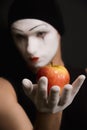 Mime with red apple Royalty Free Stock Photo