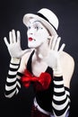 Mime with red bow ina white hat and striped gloves Royalty Free Stock Photo