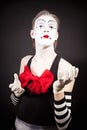 Mime with a red bow in striped gloves