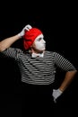 Mime thinking and touching head. Portrait of an actor Royalty Free Stock Photo