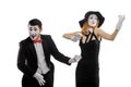 Mimes playing imaginary music instruments