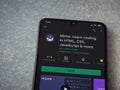 Mimo - Learning coding app play store page on the display of a black mobile smartphone on ceramic stone background