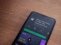 Mimo - Learning coding app play store page on the display of a black mobile smartphone on wooden background