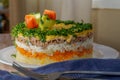 Mimosa Salad. Layers of carrots, fish, potatoes and grated hard-boiled egg, covered with mayonnaise